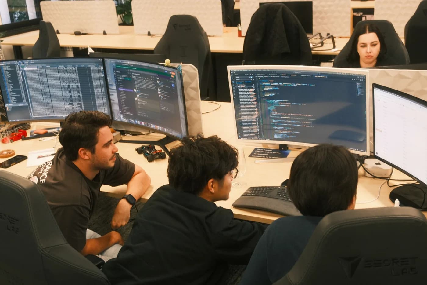 Moonward developers reviewing code together at their desks