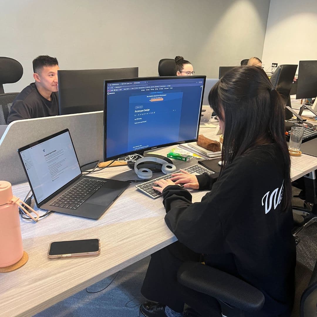 Moonward Team Member sitting at their desk
